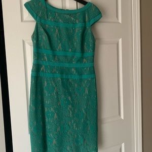 Green lace with nude lining, knee length dress.